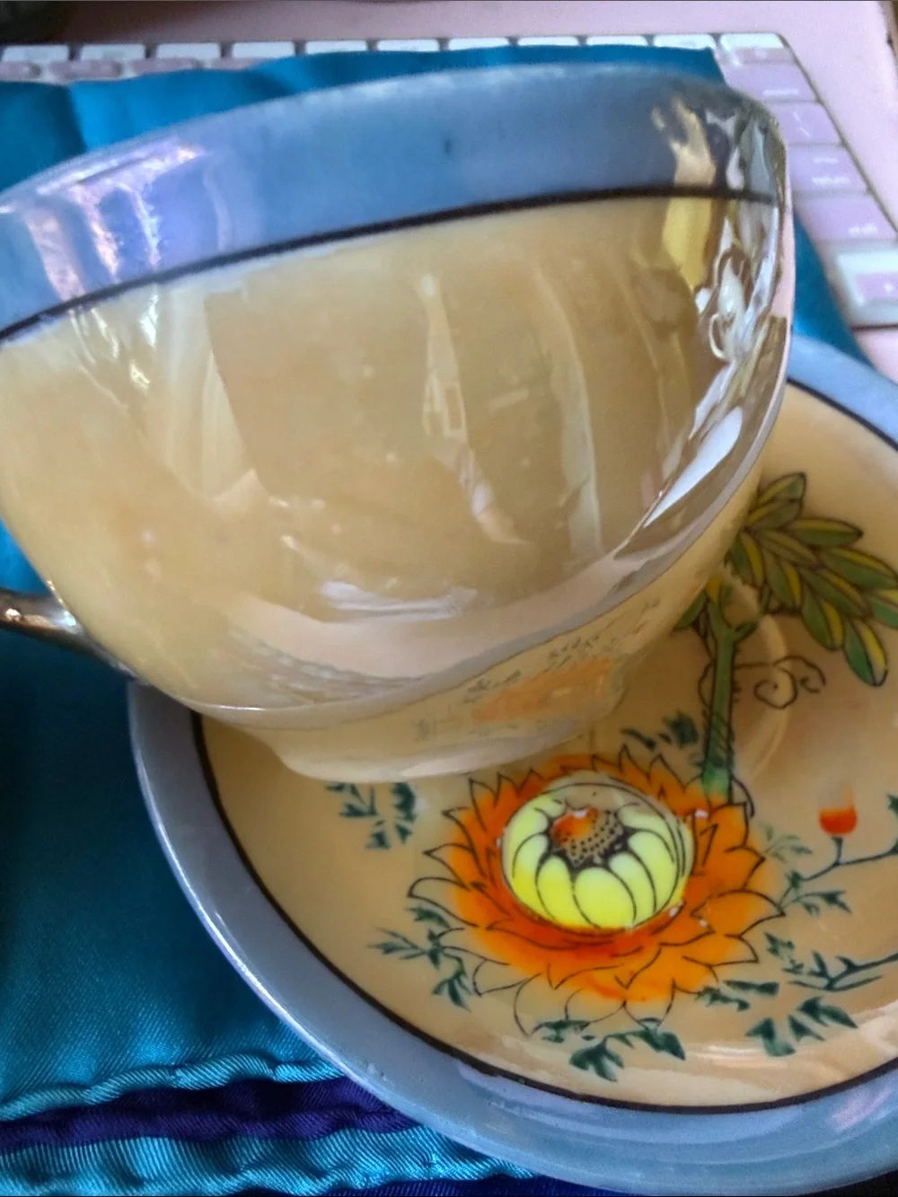 Vintage ca 1940-50’s  made in Japan orange flower lusterware tea cup & saucer